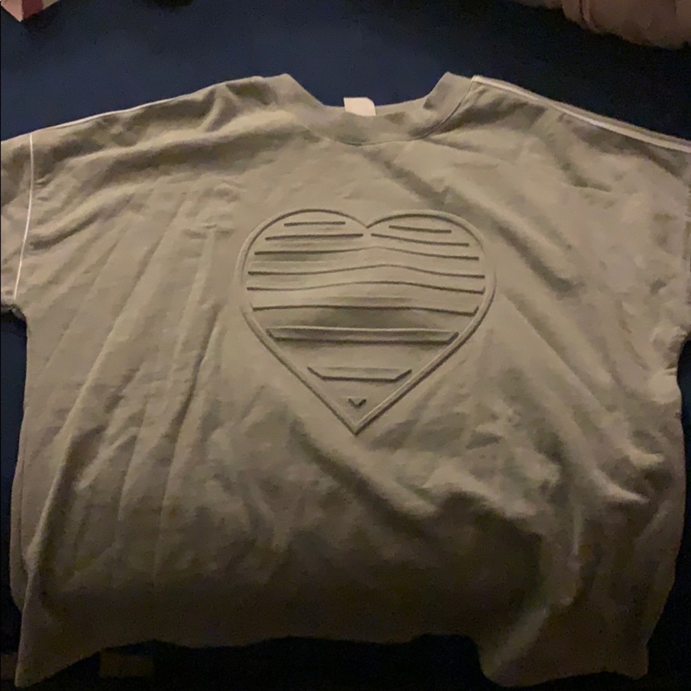 Comfortable sweatshirt , textured heart on front.